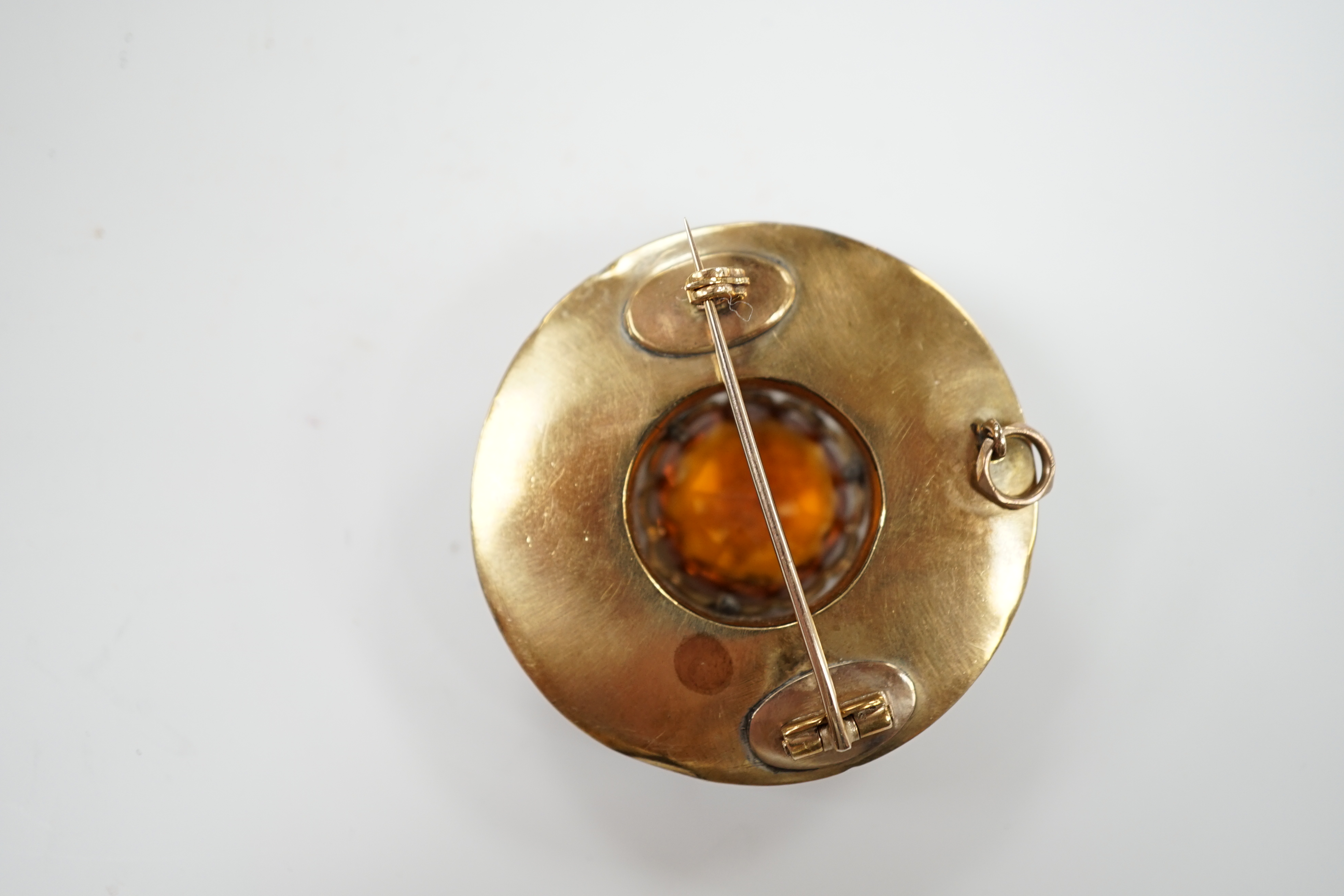 A Scottish yellow metal, citrine and Scottish hardstone set circular brooch, 41mm.